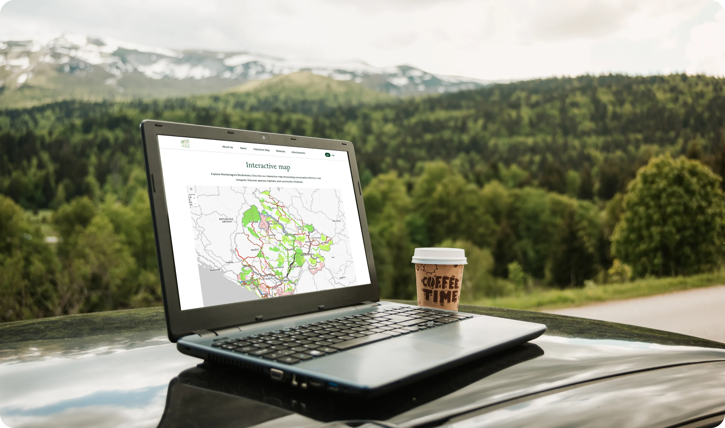 The interactive map open on a laptop in the field, showing Montenegro's conservation areas